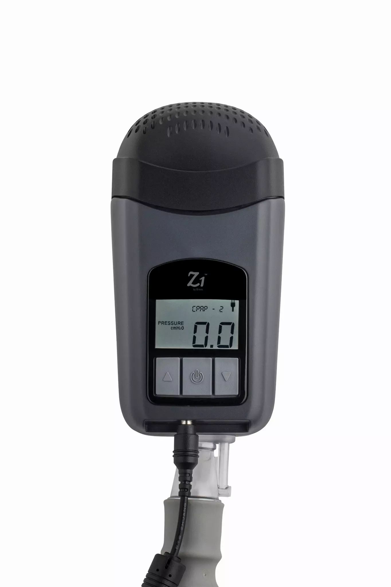 Appareil CPAP de voyage gris avec écran et connexion de tuyau, sur fond blanc.