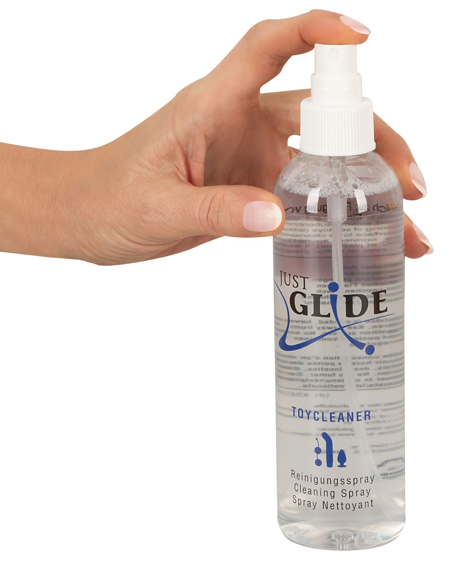 Hand die de Just Glide Toycleaner sprayfles vasthoudt.