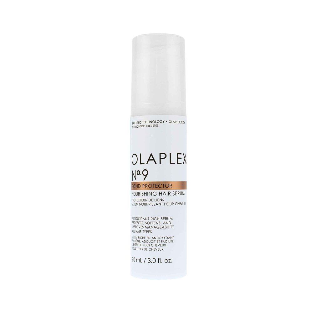 Flacon blanc Olaplex No.9 Bond Protector avec pompe. Inscription : Nourishing Hair Serum. Bande marron avec nom du produit.