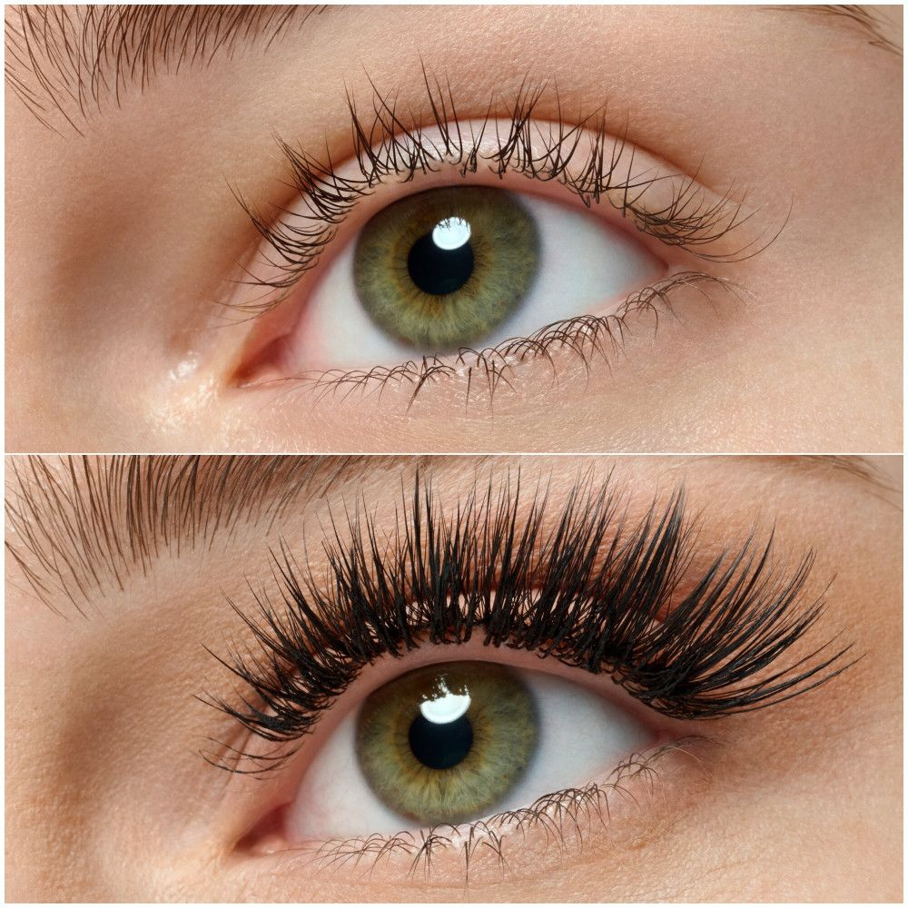 Gros plan sur des yeux avec cils naturels et faux cils. Yeux verts.