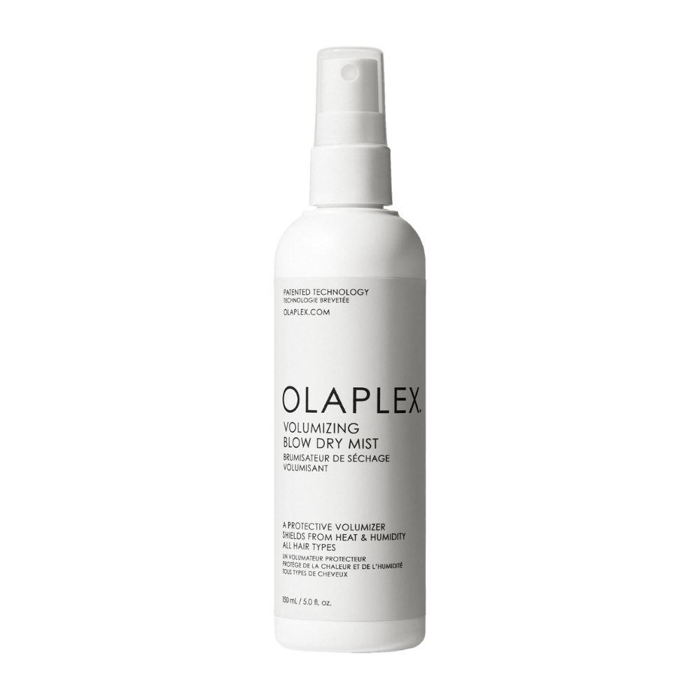Flacon vaporisateur blanc OLAPLEX. Texte: Volumizing Blow Dry Mist. Protège de la chaleur et de l'humidité. 150 ml.