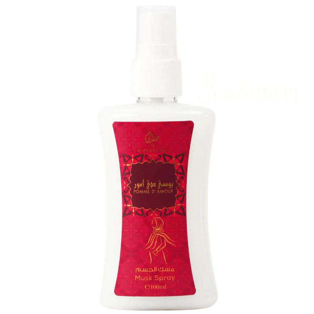 Spray blanc avec étiquette rouge. Caractères arabes et illustration d'une femme sont visibles.