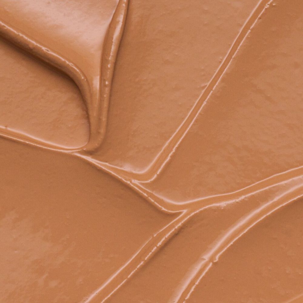 Close-up van een bruine, romige substantie, vermoedelijk oogcontourpen Bright Eyes!