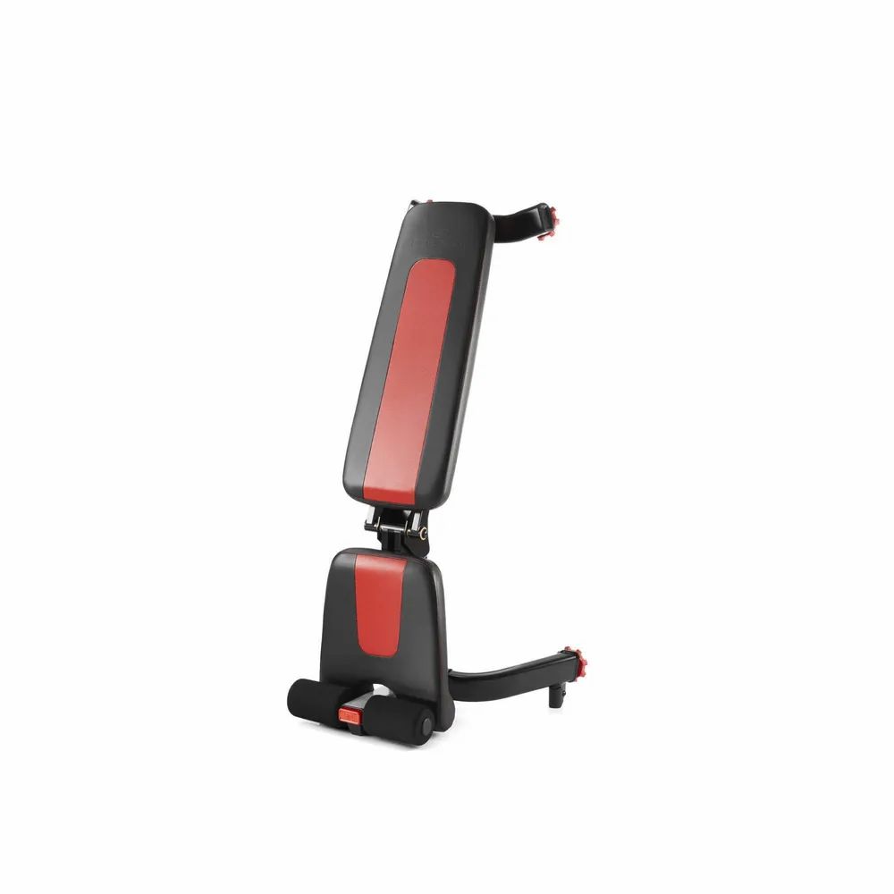 Banc de musculation pliable, noir avec accents rouges. Dossier et siège rembourrés. Support de jambe avec coussinets en mousse. Cadre métallique.