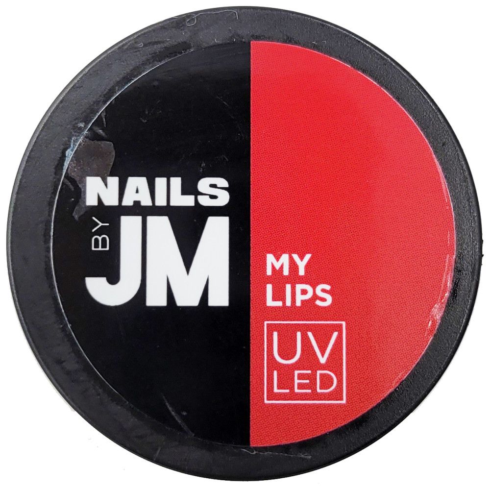 Contenant rond, divisé noir et rouge. Inscriptions "NAILS BY JM", "MY LIPS" et "UV LED".