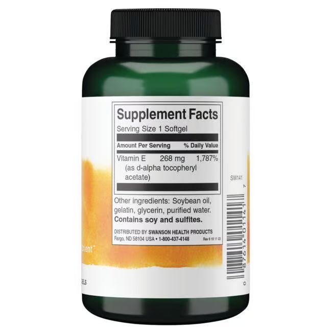 Achterkant van de groene fles. Etiket met "Supplement Facts" en informatie over vitamine E.