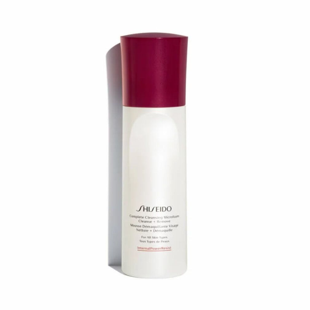 Flacon blanc et rouge Shiseido Microfoam nettoyant. Forme cylindrique, bouchon rouge. Texte: Complete Cleansing Microfoam.