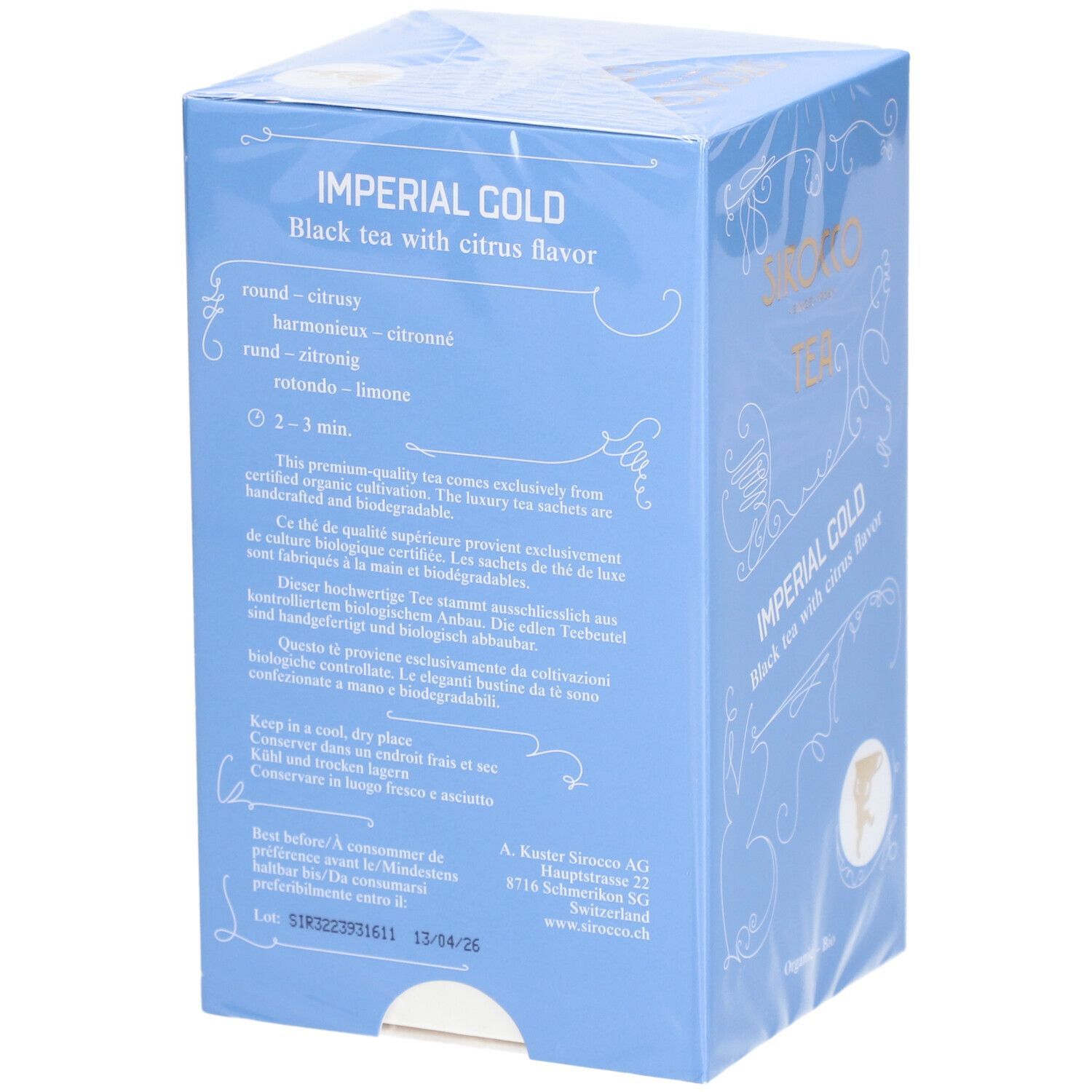 Boîte bleu clair avec texte. "Sirocco Tea Imperial Gold Black mit Zitrone & Orange". Dos avec instructions.