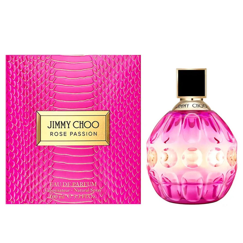 Roze fles met zwarte dop en gouden letters. Roze doos met gouden letters ernaast.