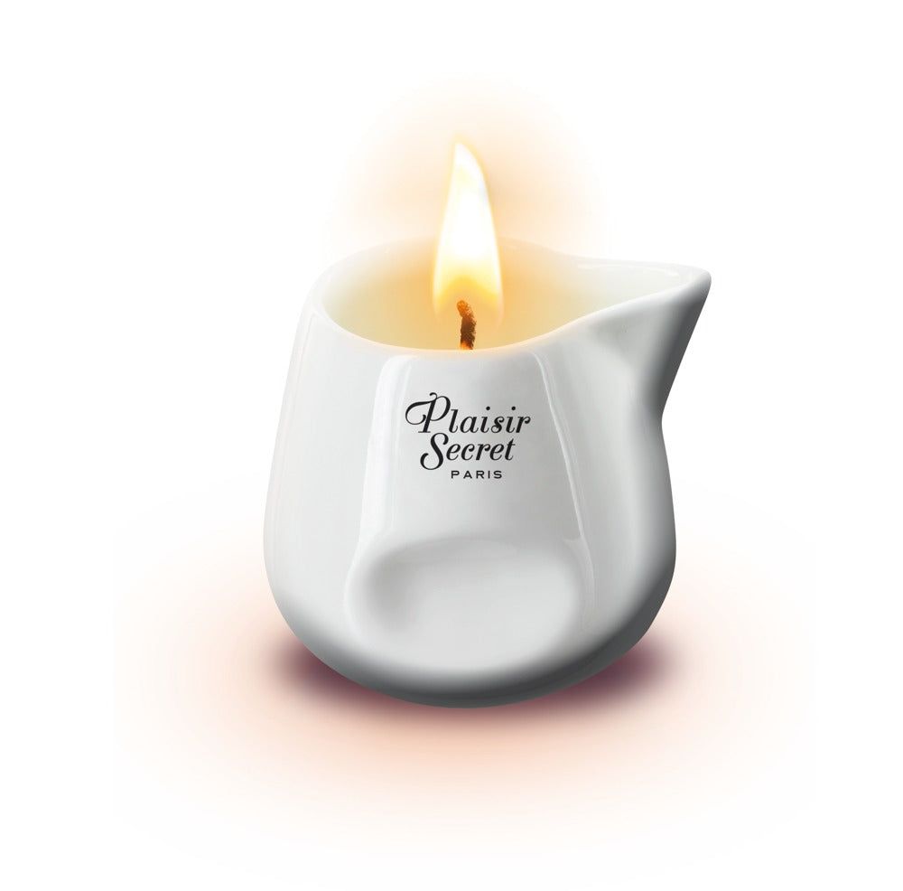 Witte keramische massagekaars met vlam. Opschrift: Plaisir Secret PARIS.