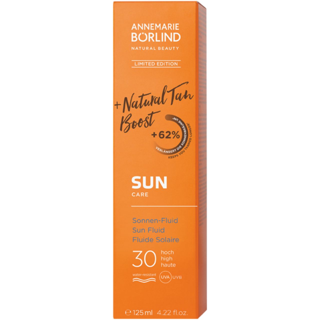 Tube orange avec nom du produit et SPF 30. Texte: Natural Tan Boost, Sun Care, Fluiide Solaire, 125 ml.