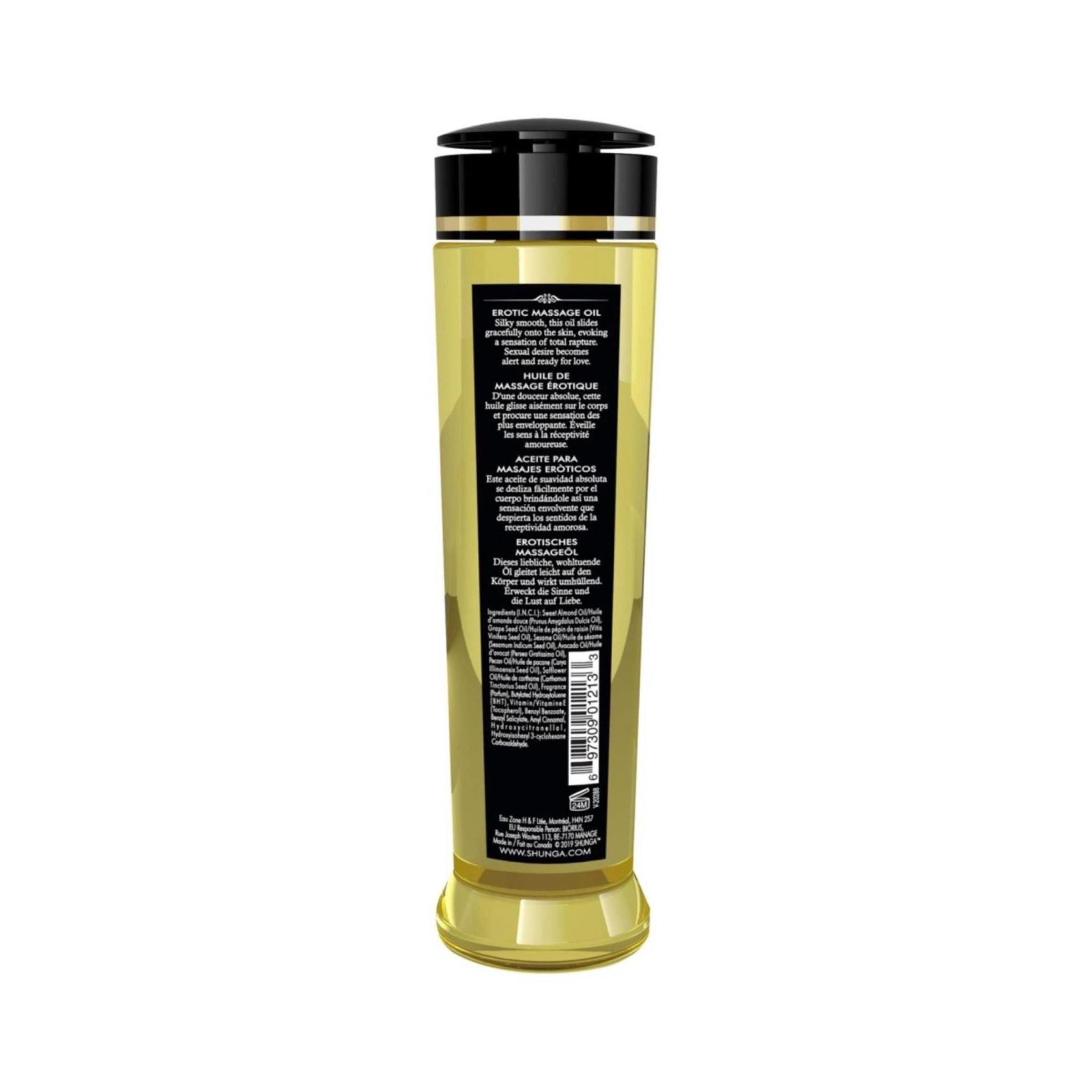 Achterkant van een Shunga Massageolie Serenity Monoi fles met gedetailleerde gebruiksinstructies en ingrediënten in meerdere talen.