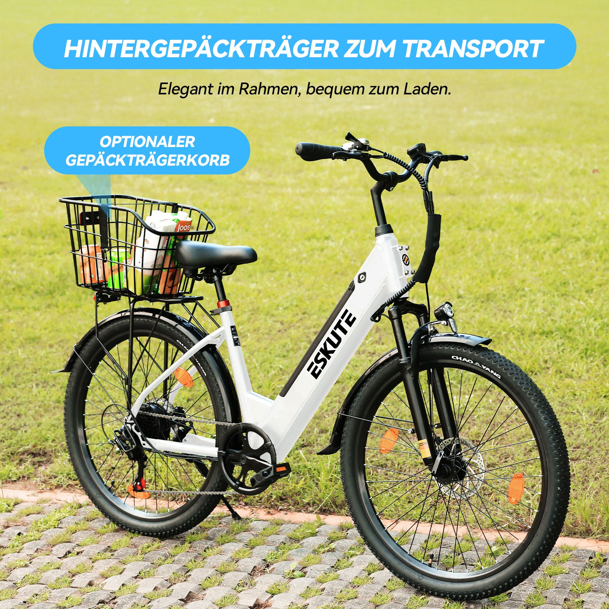 Witte elektrische fiets met mand. Tekst: Achterdrager voor transport. Merk ESKUTE.