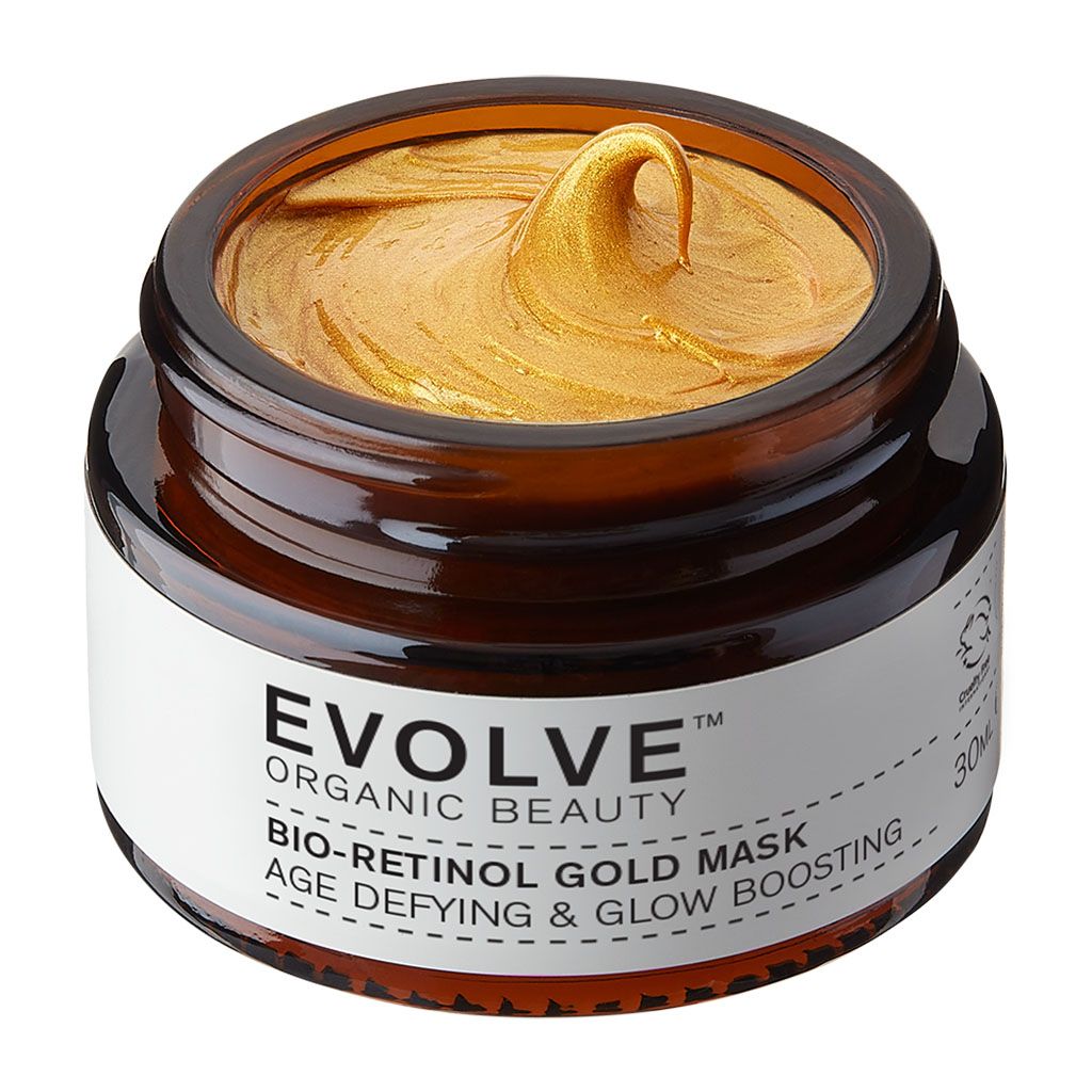 Pot en verre ambré contenant un masque doré. Étiquette : EVOLVE ORGANIC BEAUTY BIO-RETINOL GOLD MASK AGE DEFYING & GLOW BOOSTING.