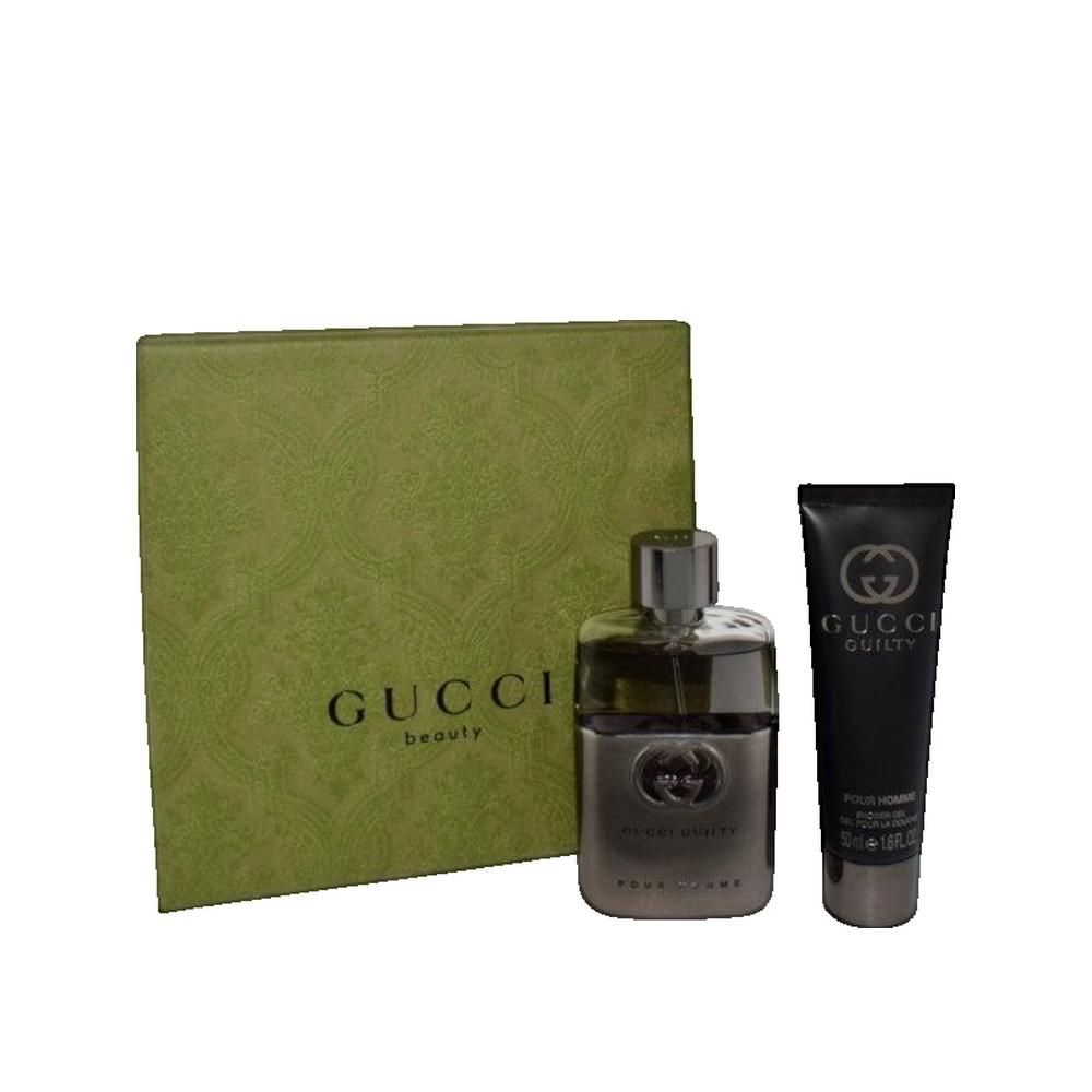 Coffret cadeau avec flacon de parfum, tube et boîte. Flacon et tube avec logo Gucci. Boîte avec inscription Gucci.