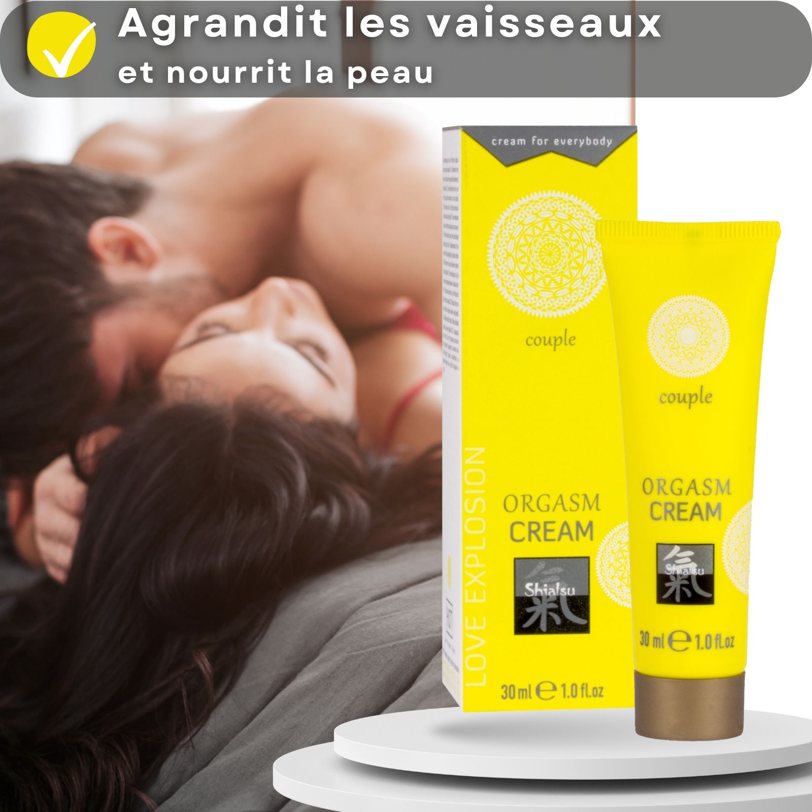 Tube et boîte jaunes. Inscription : ORGASM CREAM, Shiatsu, 30 ml. Couple en arrière-plan.