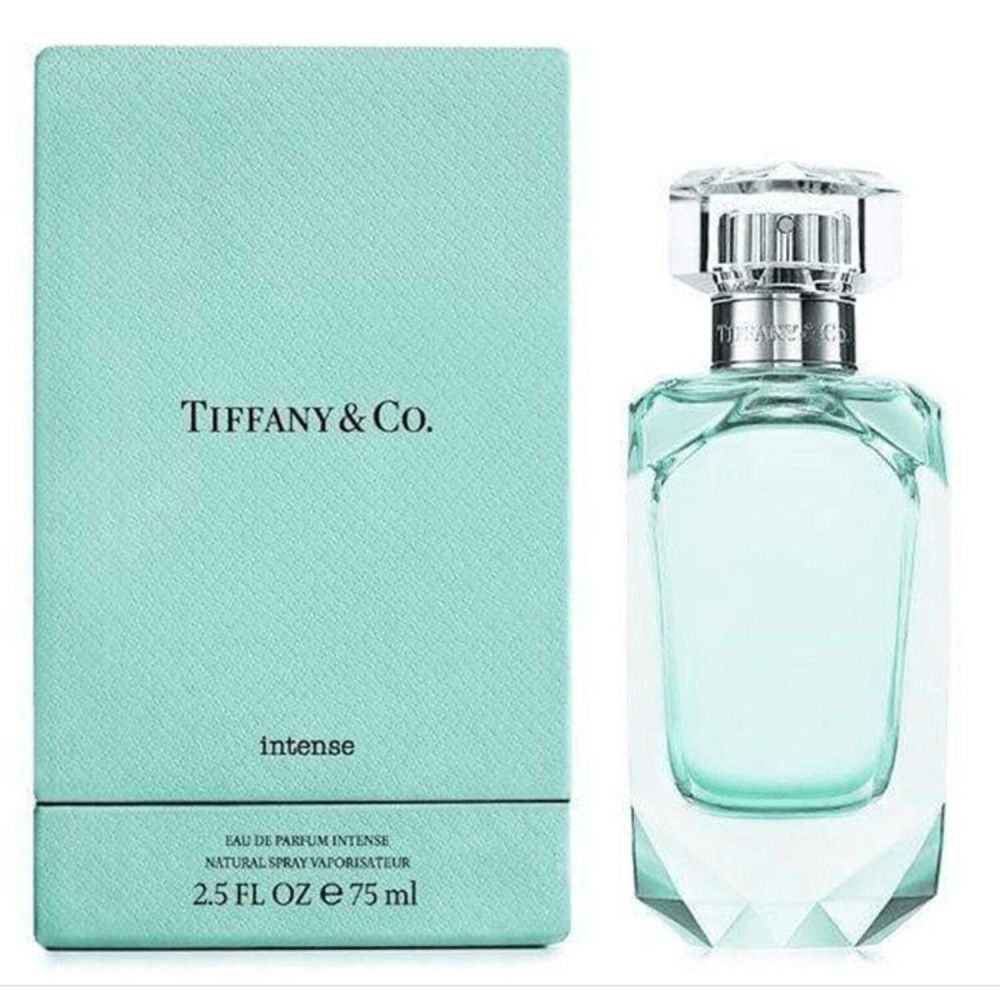 Boîte et flacon turquoise. Flacon taillé à facettes, bouchon argenté. Tiffany & Co. est écrit sur la boîte.