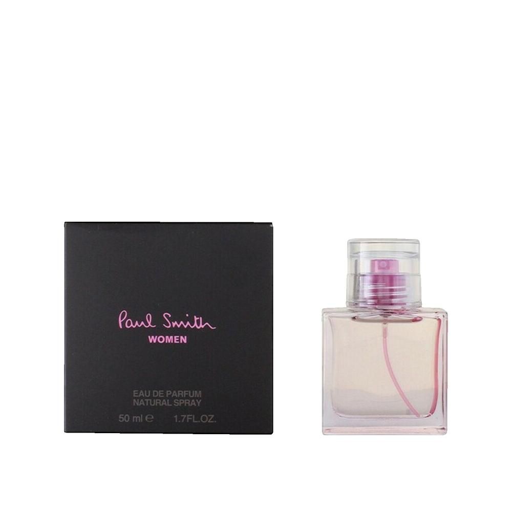 Flacon et boîte. Flacon rectangulaire en verre avec liquide rose et vaporisateur. Boîte noire avec inscription rose: Paul Smith Women.
