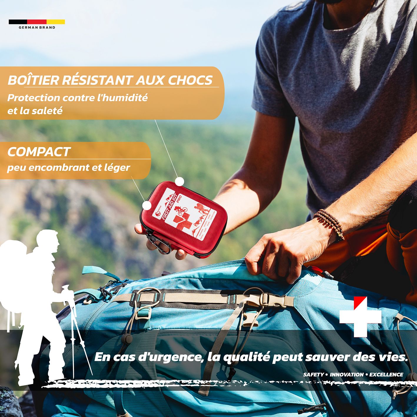 Trousse de premiers secours rouge. Texte : « FIRST AID KIT PRO ». Avec mousqueton.