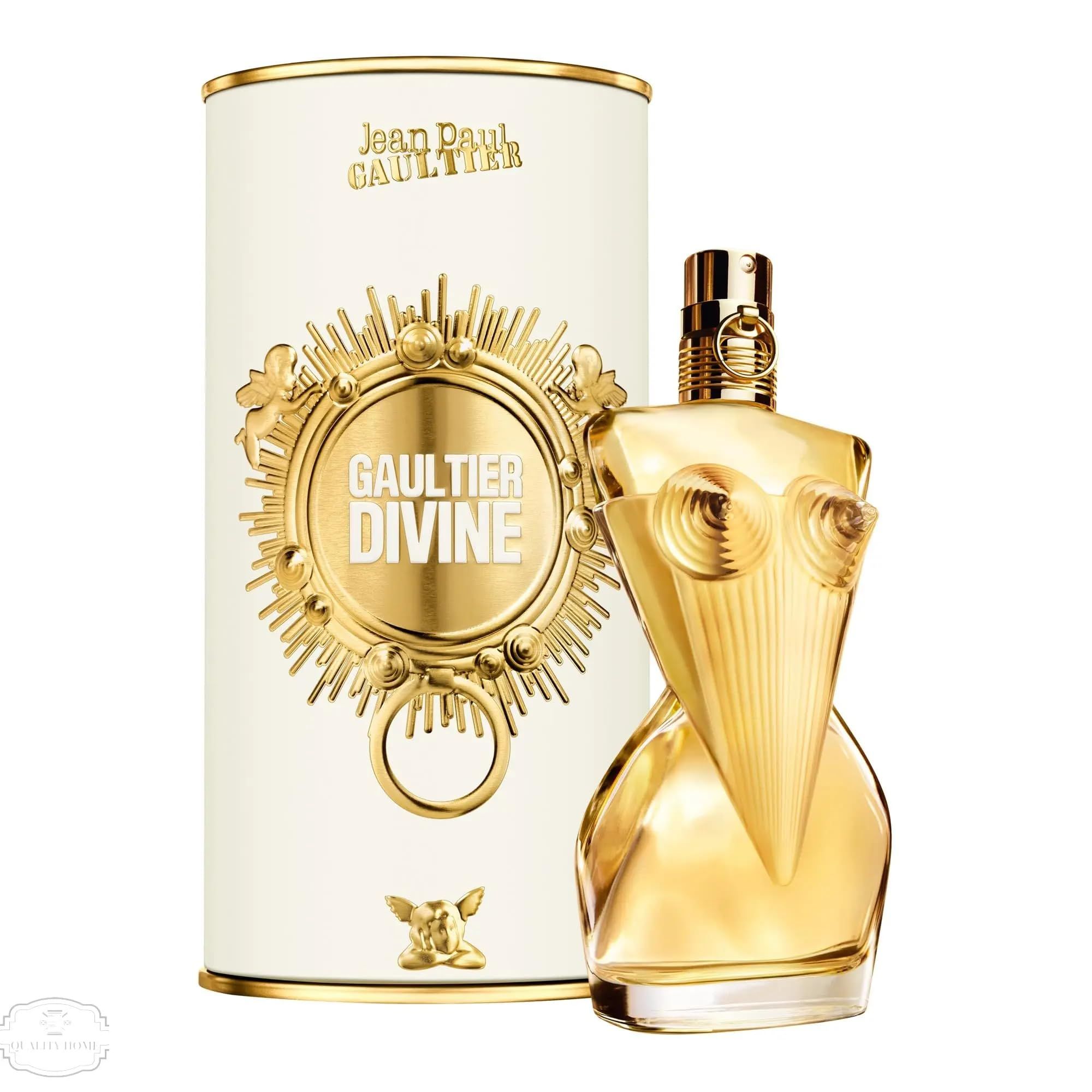Parfumfles en verpakking. Gouden fles in de vorm van een bovenlichaam. Witte cilindrische verpakking met gouden details en tekst.