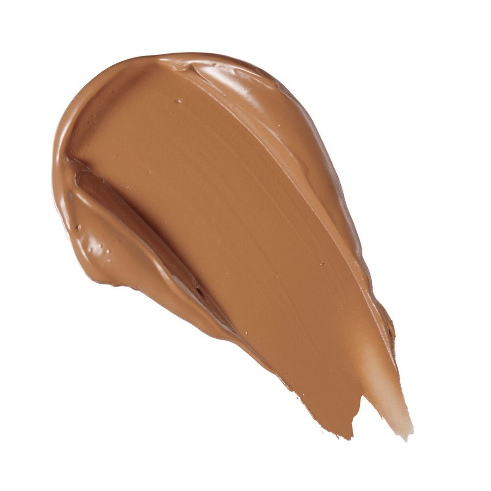 Échantillon de correcteur brun clair. Texture: crémeuse. Fond: blanc.