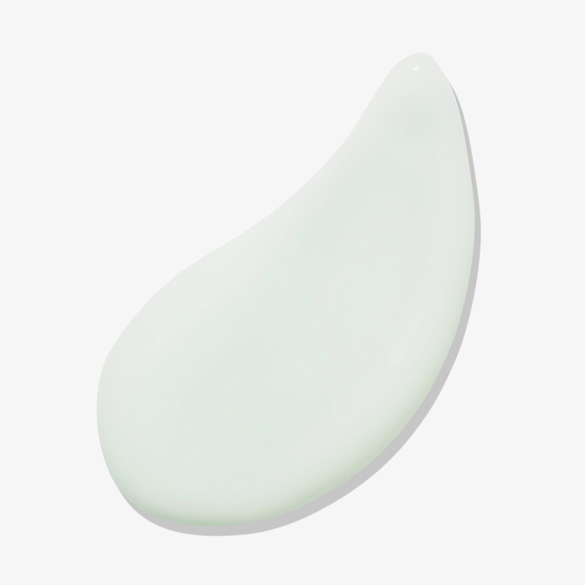 Goutte de gel vert clair sur fond blanc.