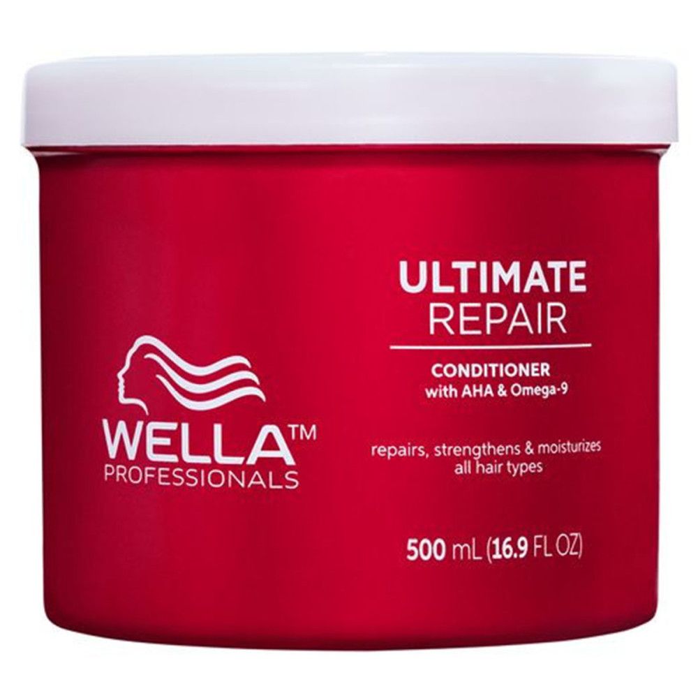 Rode pot met witte deksel. Opschrift: ULTIMATE REPAIR, Conditioner, Wella Professionals logo. Bevat 500 ml.