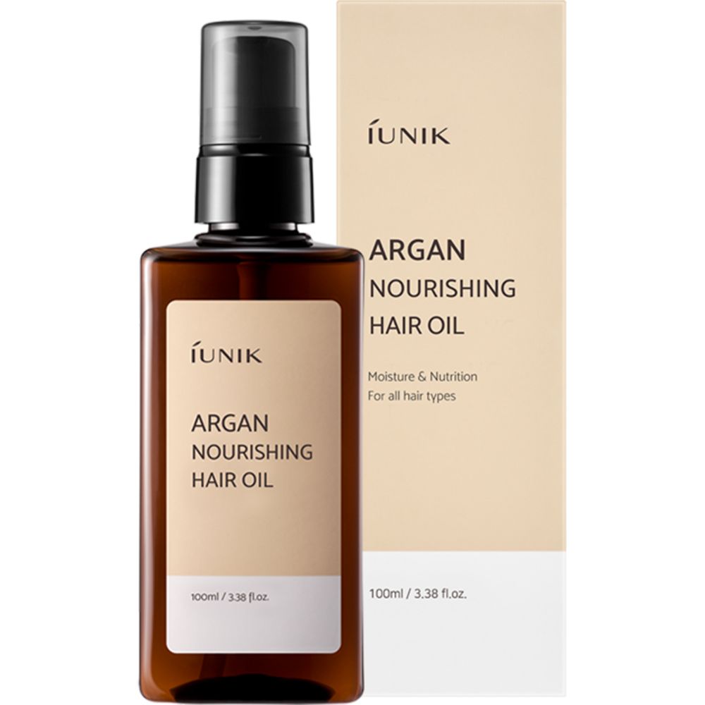 Bruine fles met zwarte pomp en verpakking. Tekst: Argan Nourishing Hair Oil, Moisture & Nutrition.