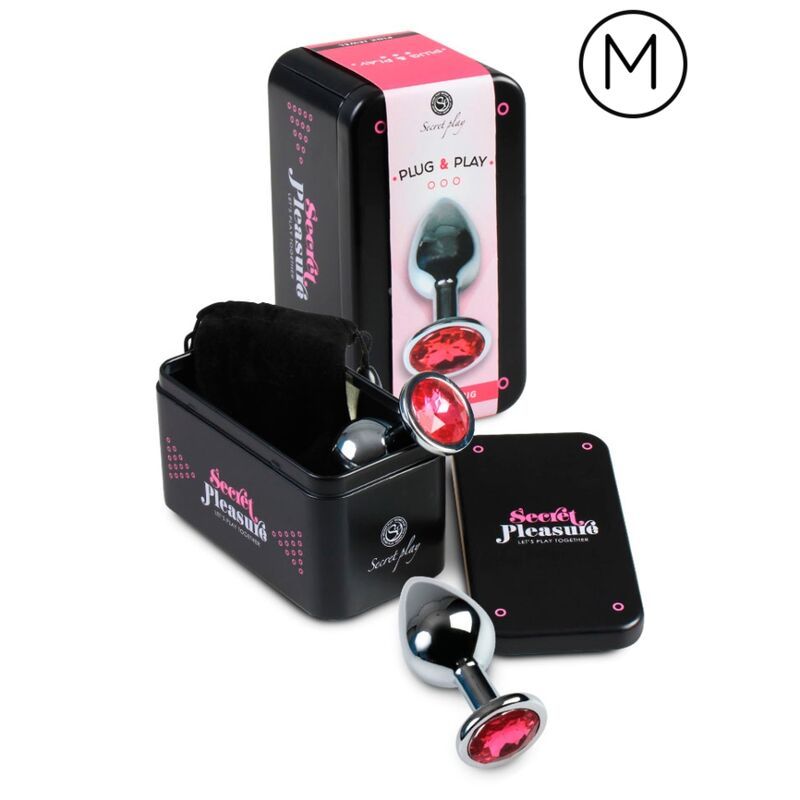 Ensemble de plugs anaux dans une boîte en métal : un plug avec pierre rouge, un autre plug, une pochette et des instructions.