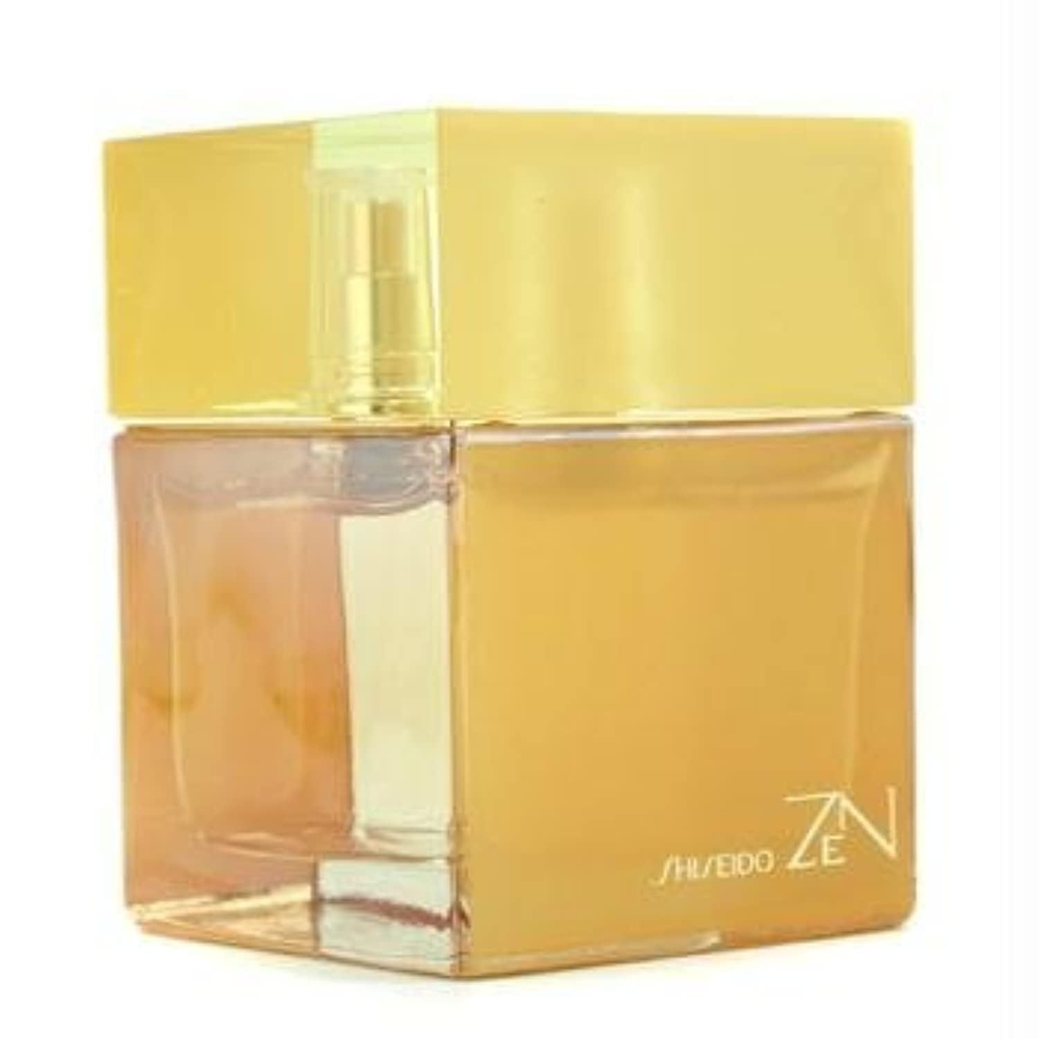 Flacon doré carré avec bouchon et vaporisateur dorés. Inscription Shiseido Zen.
