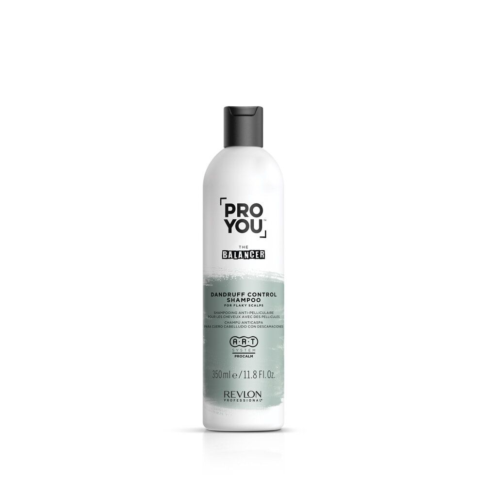 Flacon de shampooing blanc avec bouchon noir. Inscription : PRO YOU THE BALANCER, Dandruff Control Shampoo. Marque : Revlon.