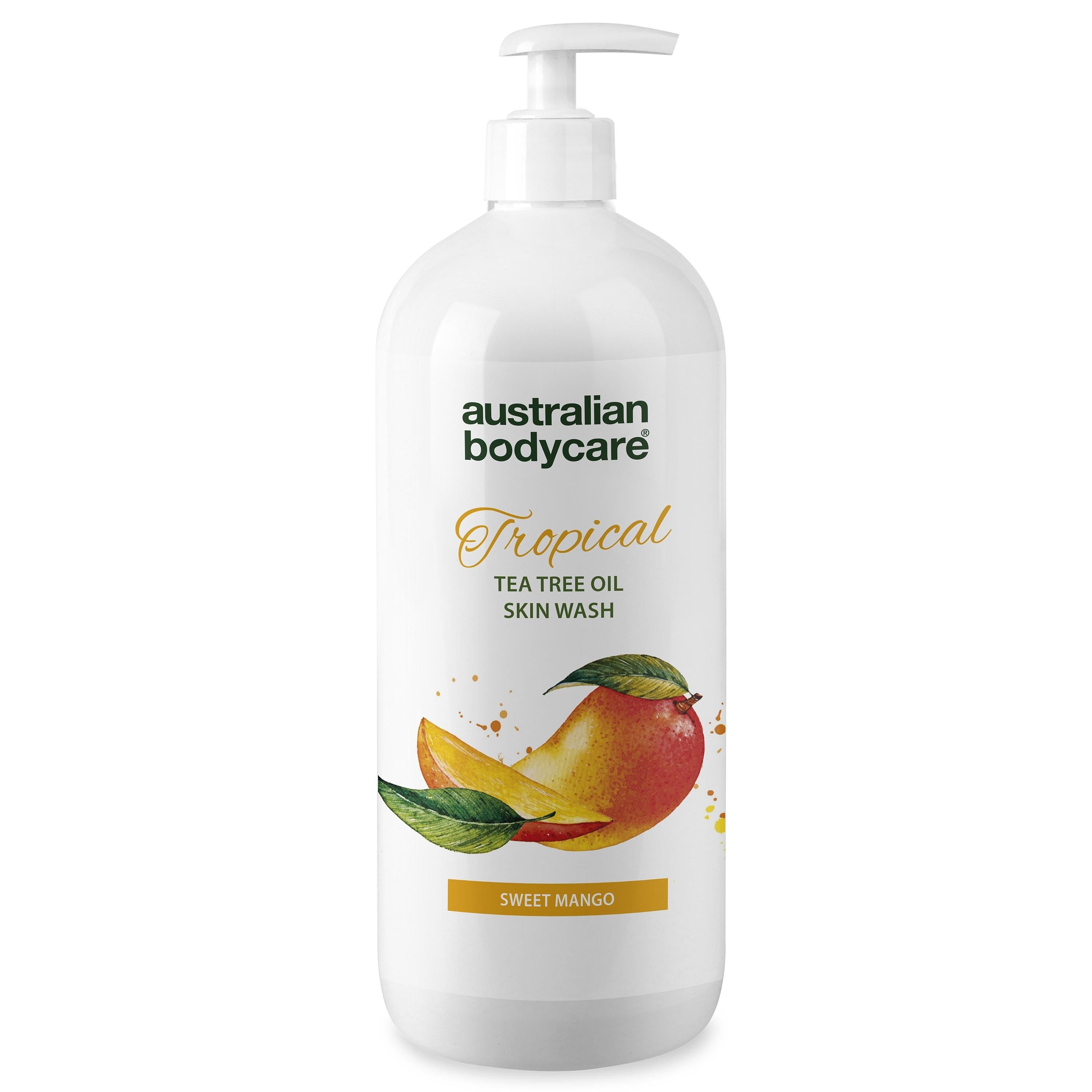 Witte fles met etiket. Mango-illustratie. Tekst: Australian Bodycare, Tropical, Tea Tree Oil Skin Wash, Sweet Mango.