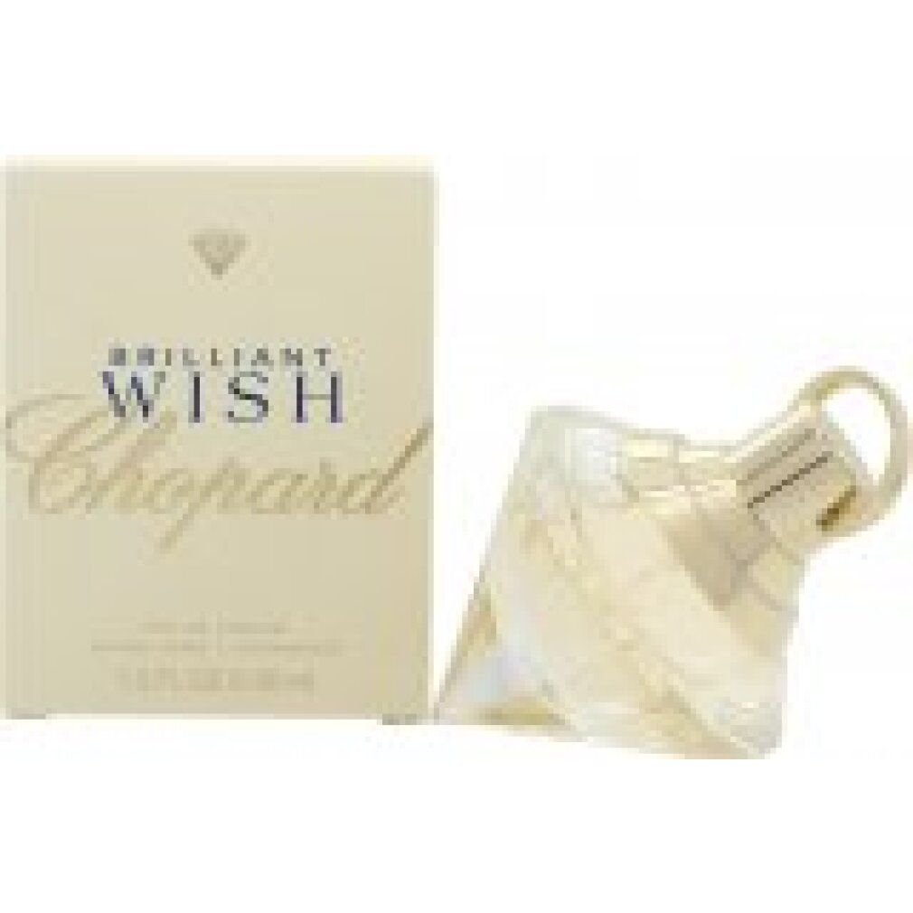 Parfumfles en verpakking. Diamantvormige fles, lichtgeel. Crèmekleurige verpakking met opschrift 'Brilliant Wish Chopard'.