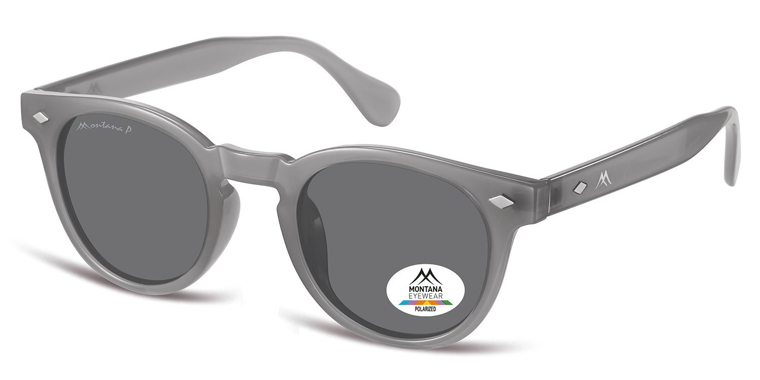 Lunettes de soleil grises avec verres ronds. Un autocollant avec logo et texte est présent sur un verre. La monture et les branches sont visibles.