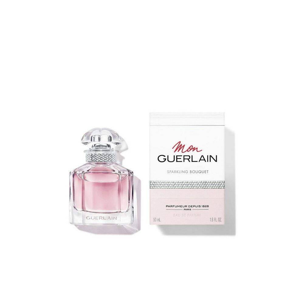 Parfumfles en verpakking. Fles met roze vloeistof. Verpakking met opschrift Mon Guerlain Sparkling Bouquet.