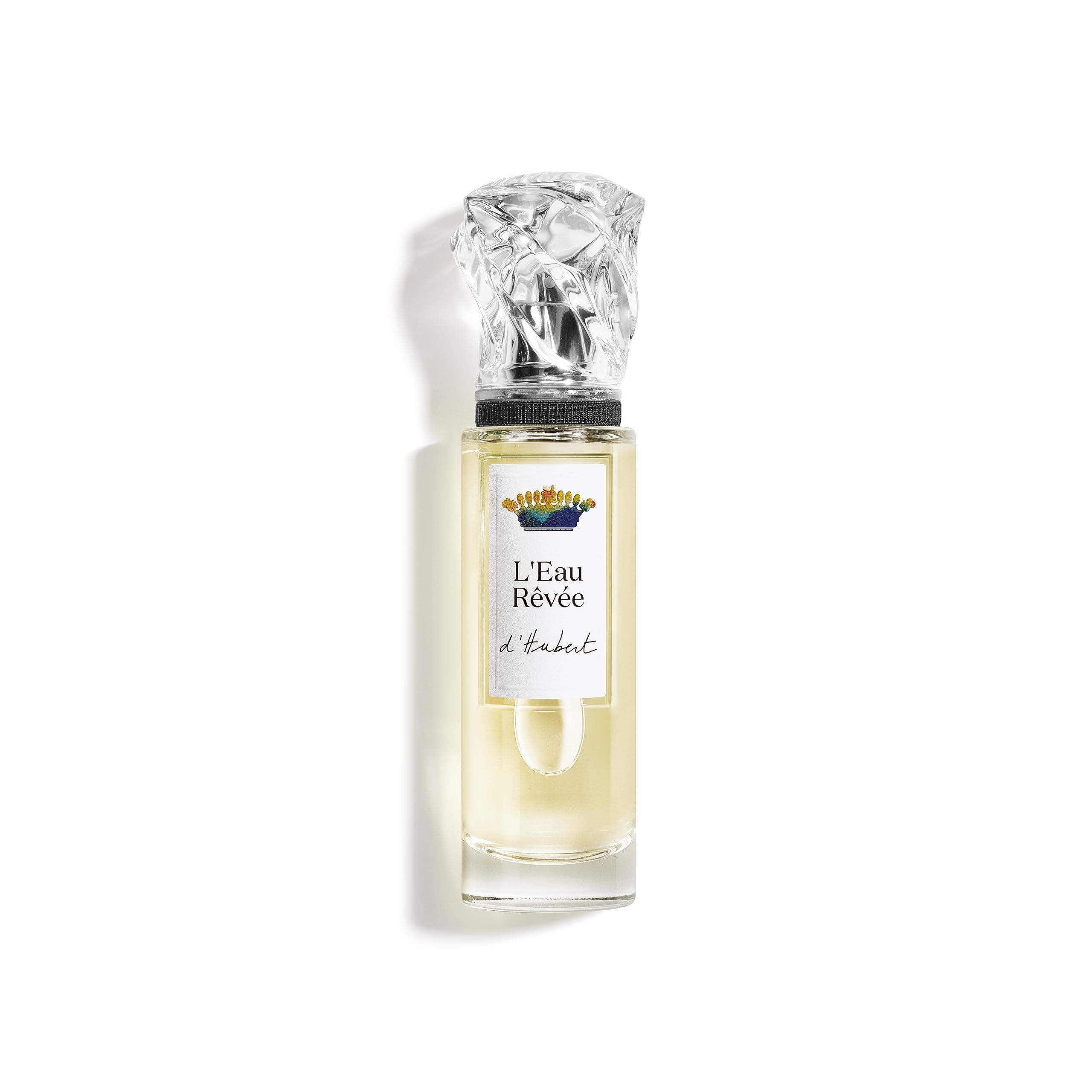 Flesje van transparant glas, zilveren dop en etiket met opschrift L'Eau Rêvée d'Hubert. Lichtgele vloeistof.