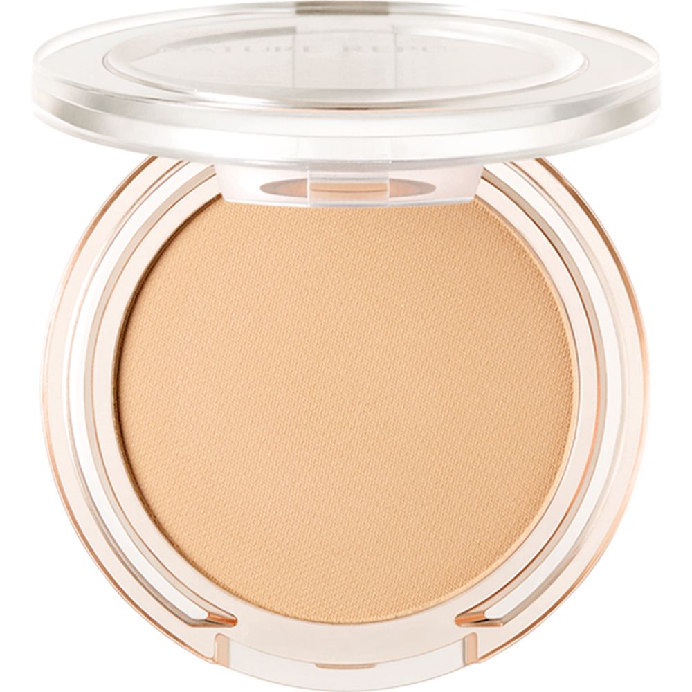 Un contenant rond avec un produit beige. Le couvercle est ouvert. Le contenant est transparent.