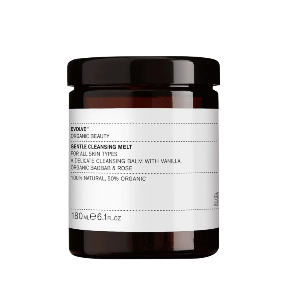 Pot en verre brun avec couvercle noir. Étiquette blanche avec "GENTLE CLEANSING MELT" et informations. 180ml.