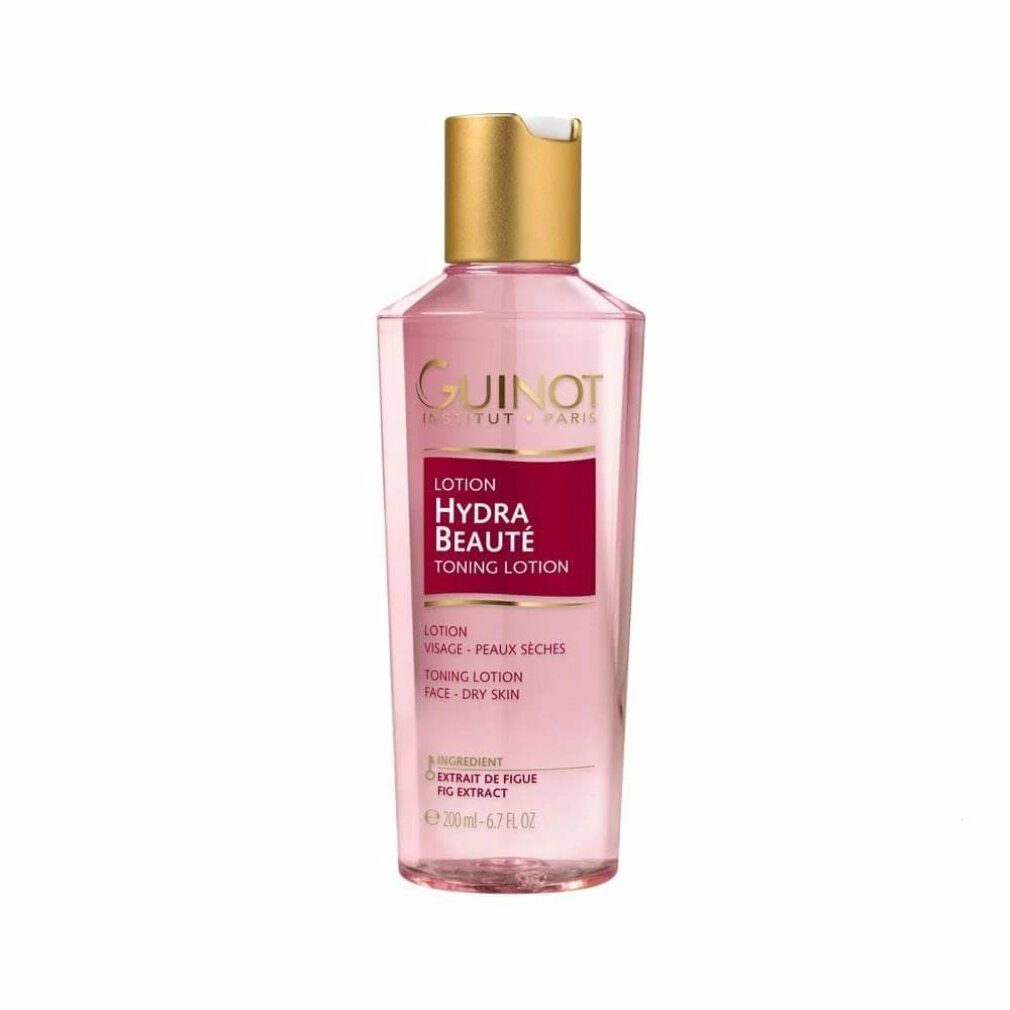 Guinot Hydra Beaute Lotion. Transparante fles met roze vloeistof, gouden dop. Rood etiket met productnaam.