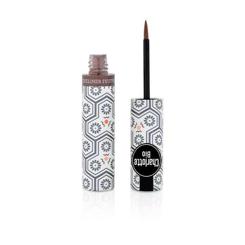 Eyeliner liquide brun. Applicateur noir. Emballage à motifs floraux et logo.