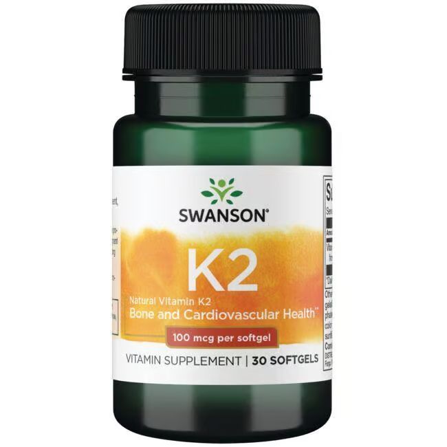 Flacon vert avec bouchon noir. Inscription: SWANSON K2, Natural Vitamin K2, 100 mcg par gélule, 30 gélules.