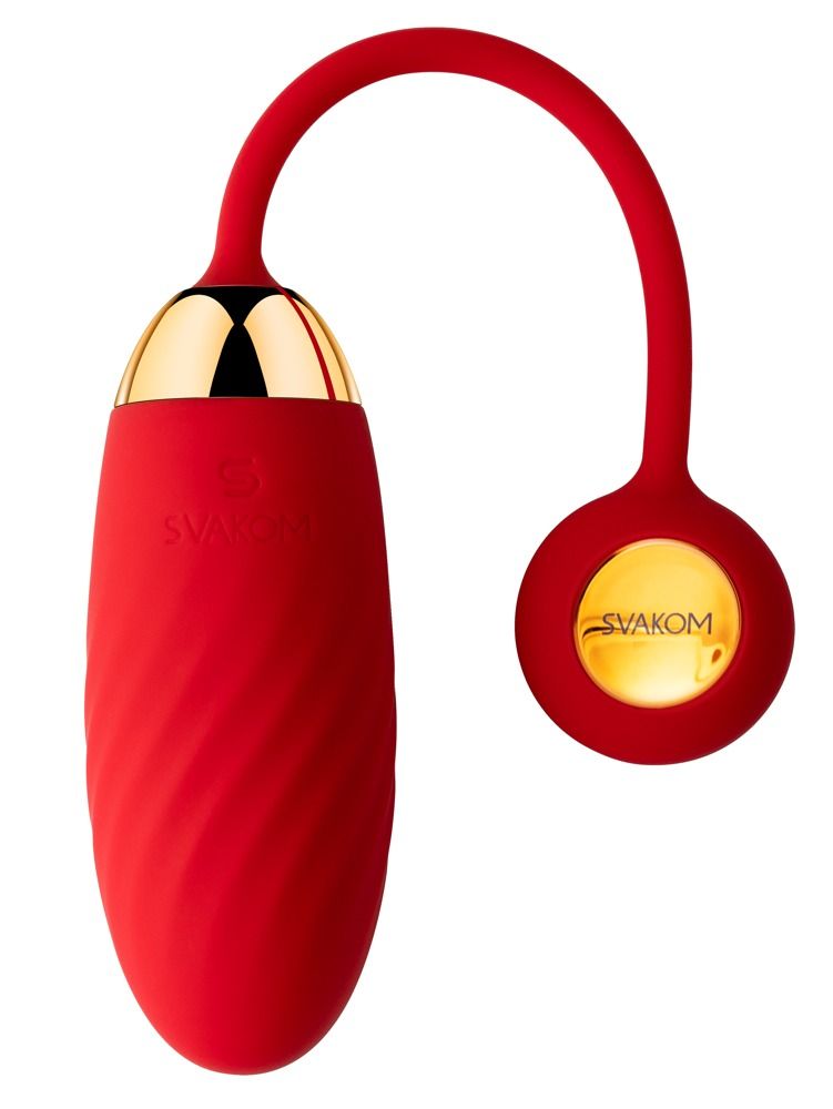 Balle vibrante rouge avec embout doré et partie de contrôle attachée.