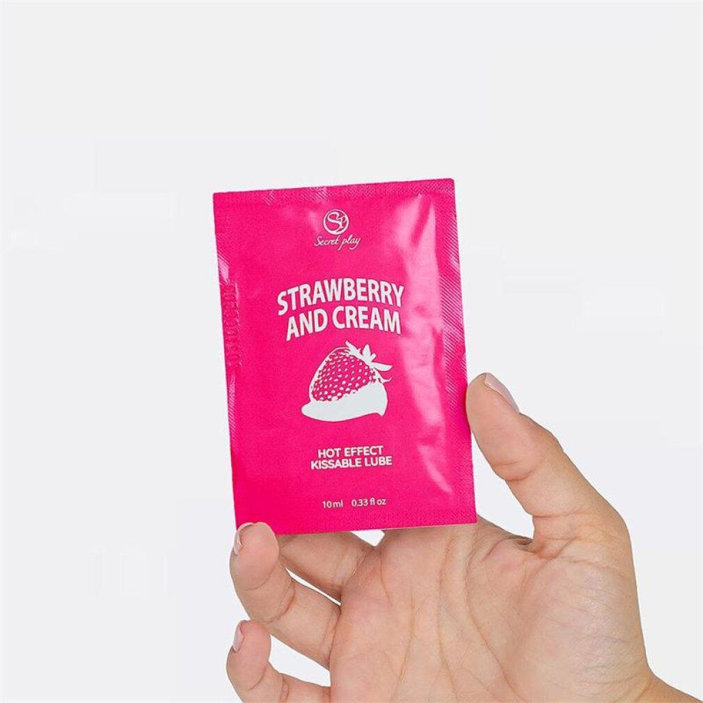 Kleine roze verpakking met aardbei en crème glijmiddel. Bevat 'Hot Effect Kissable Lube'.