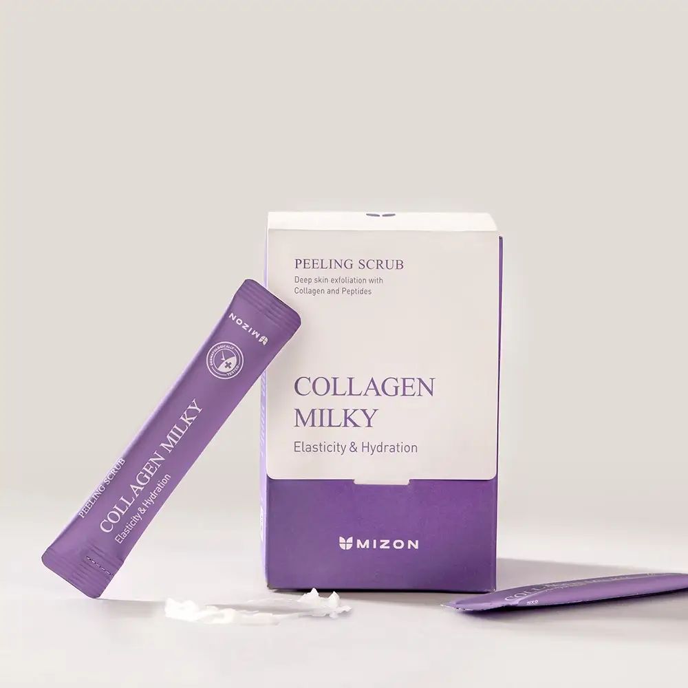 Witte verpakking met paarse accenten en een zakje. Opschrift: PEELING SCRUB, COLLAGEN MILKY, MIZON.