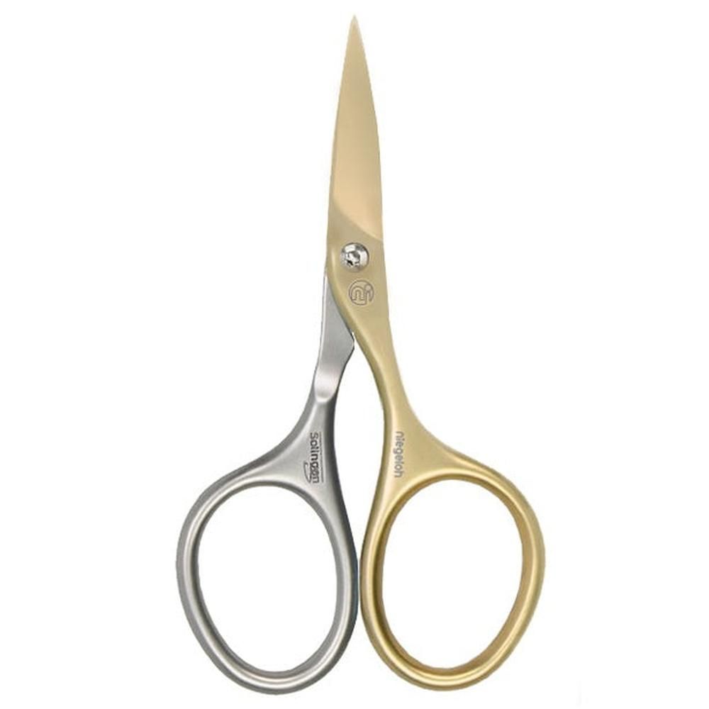 Nagelschaar met zilveren en gouden handgrepen. Gouden bladen. Opschriften "Solingen" en "Niegeloh" op de handgrepen.