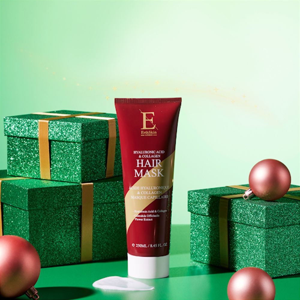 Tube rouge de masque capillaire à l'acide hyaluronique et au collagène, entouré de boîtes cadeaux vertes et de boules roses.