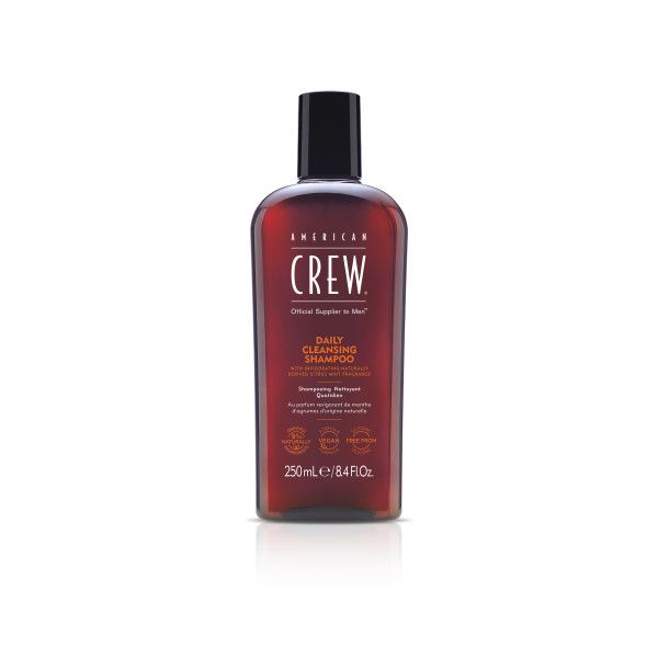 Bruine fles met zwarte dop. Opschrift: AMERICAN CREW Daily Cleansing Shampoo. 250ml.