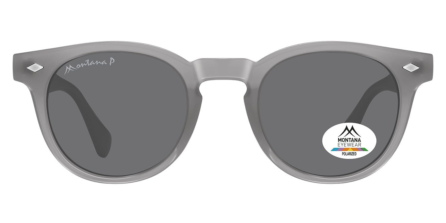 Lunettes de soleil grises avec verres ronds. Un autocollant avec logo et texte est présent sur un verre. La monture et les branches sont visibles.