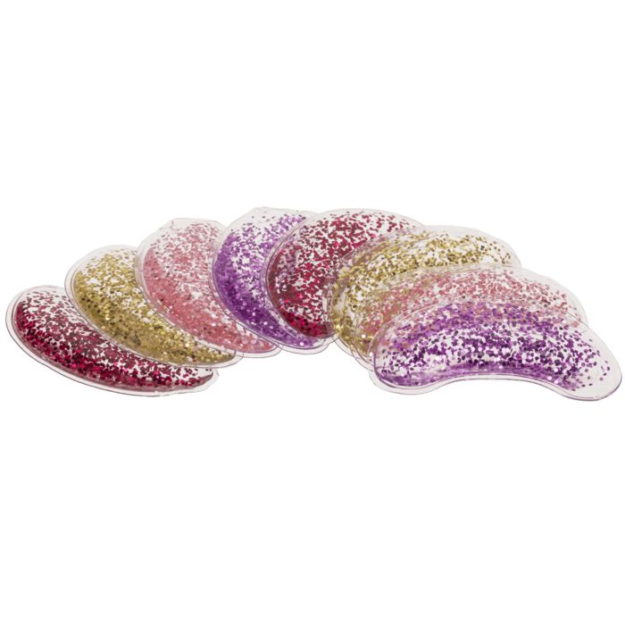 Sept eye pads de couleurs variées: or, rose, violet. En forme de croissant, remplis de paillettes.