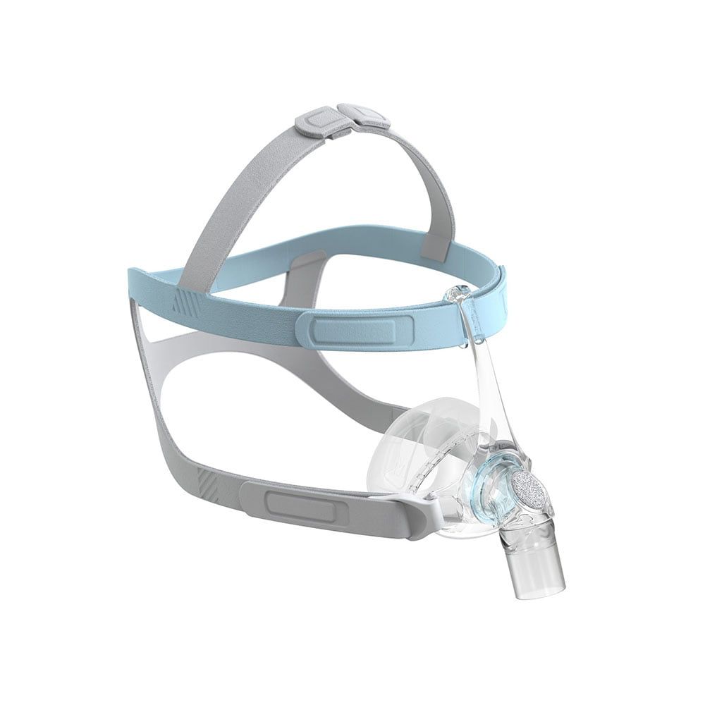 Masque nasal avec harnais bleu et corps transparent. Support gris. Vue en angle.